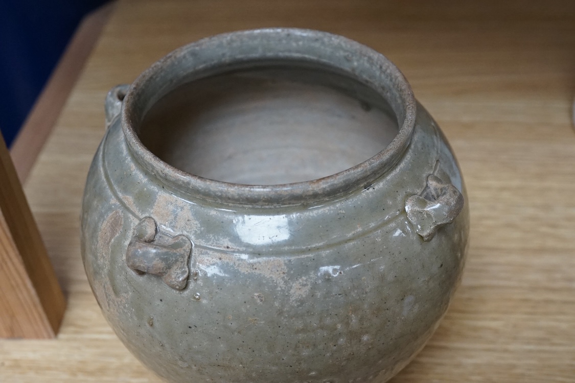 A Chinese olive green glazed jar, Tang Dynasty, 13cm